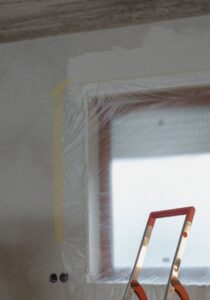 tape-and-plastic-on-window-for-painting